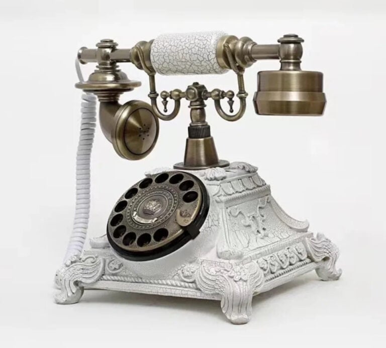A vintage or antique style rotary telephone, often referred to as a "French" or "European style" telephone from the early 20th century.